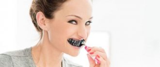 Brushing teeth with activated carbon