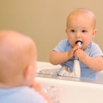 boy brushing his teeth